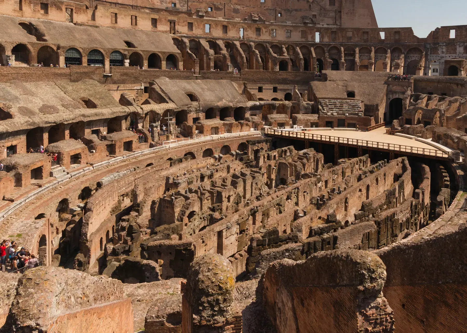 Underground galleries of the Colosseum’s hypogeum seen from above, among stone walls and arches