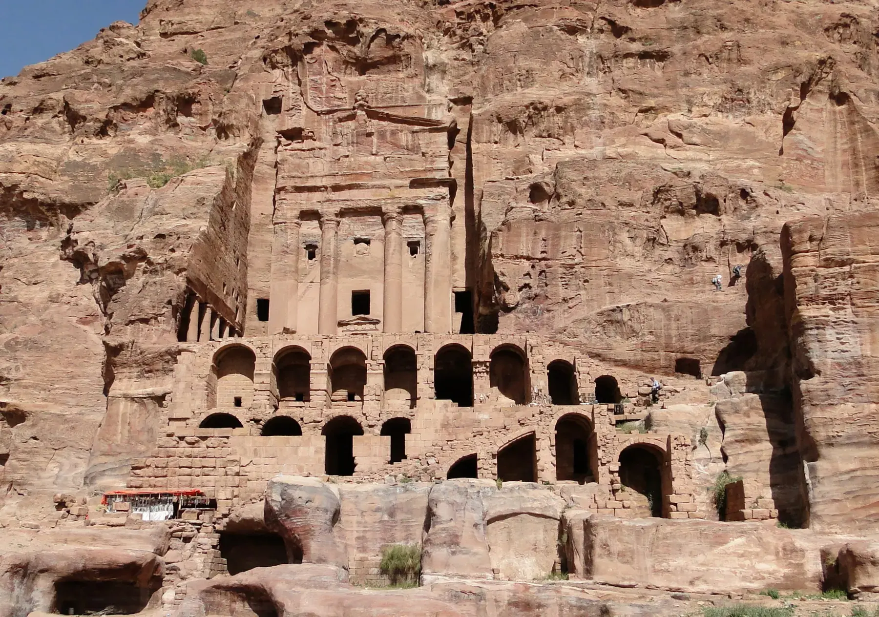 Urn Tomb, one of the Royal Tombs of Petra, with arcades cut into the sandstone hillside