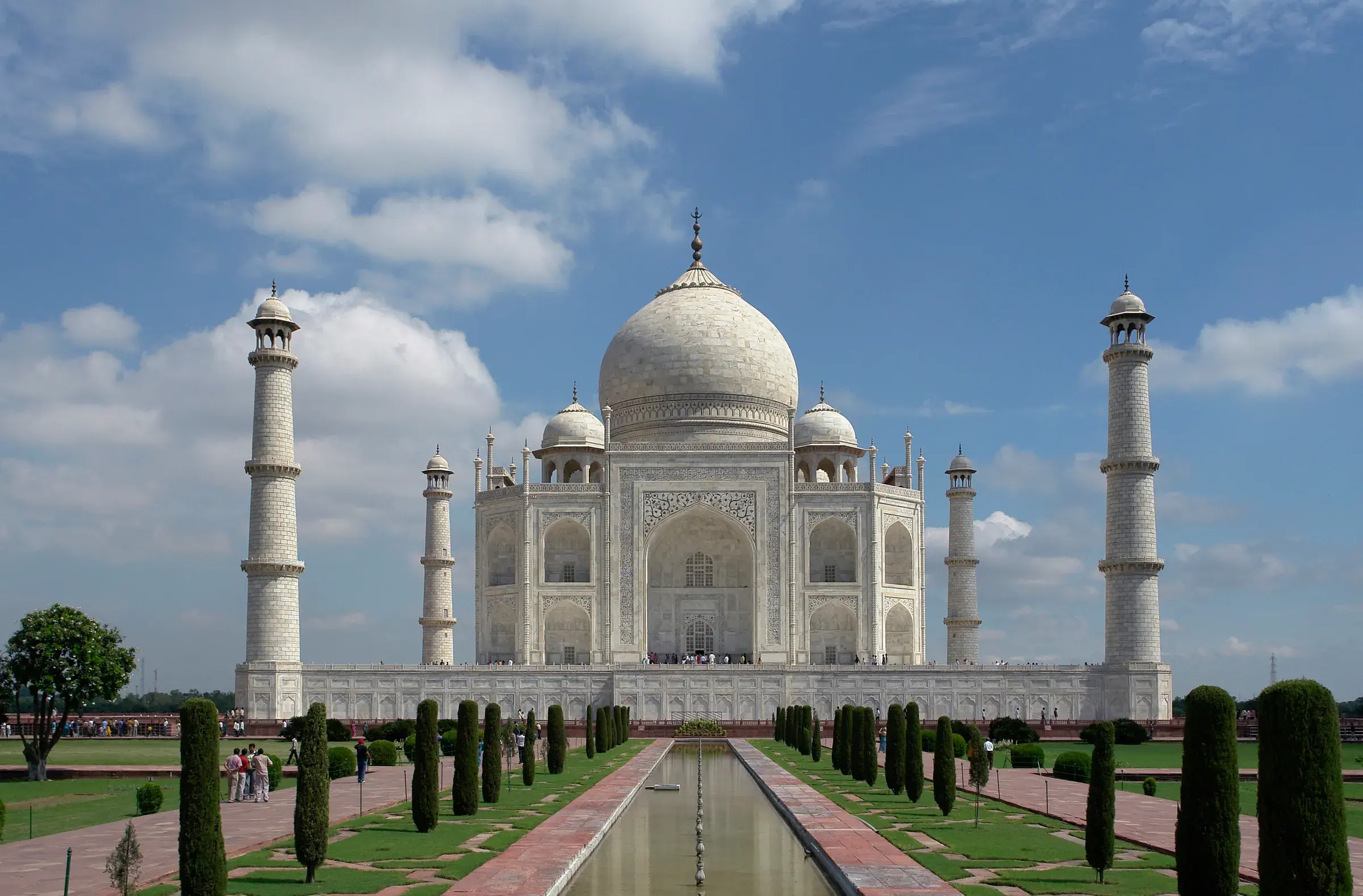 Taj Mahal seen from the front, with the reflecting pool between cypresses and gardens, in Agra